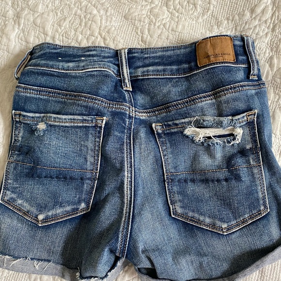 American Eagle denim shorts with rips, size 4 but could fit a 2-4. - Picture 2 of 3